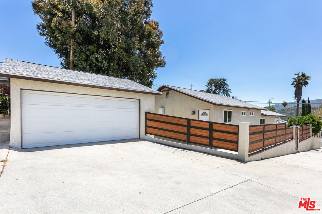7001 Beckett Street Tujunga, CA 91042 - Photo 18 of 21 a view of a terrace with a bench