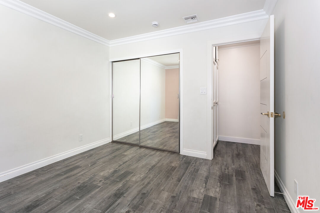 7001 Beckett Street Tujunga, CA 91042 - Photo 9 of 21 a view of an empty room with wooden floor