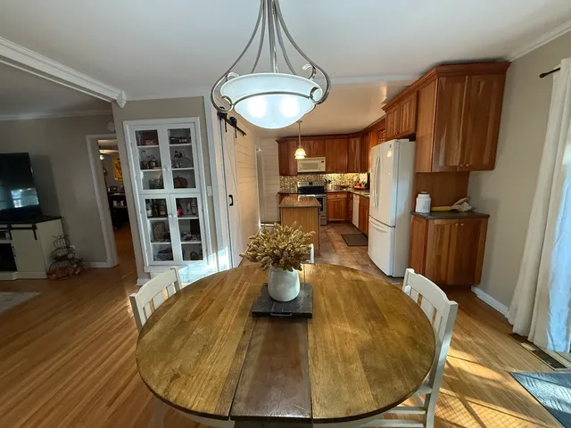 a view of a livingroom with furniture window and wooden floor