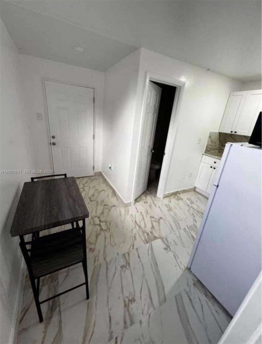 4721 Peters Road, Unit A Plantation, FL 33317 - Photo 5 of 5 a bedroom with a bed and a mirror
