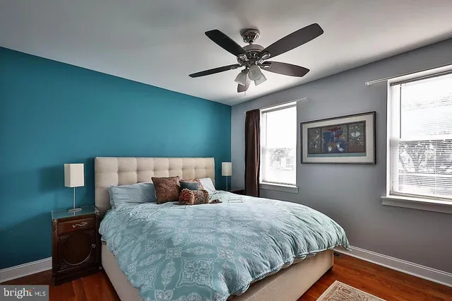 a bedroom with a large bed and a window