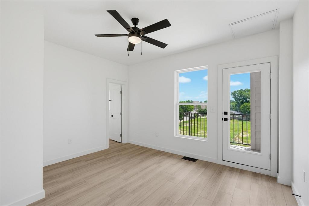 510 South O Connor Road Irving, TX 75060 - Photo 17 of 22 Interior space featuring wood-finish flooring and white walls