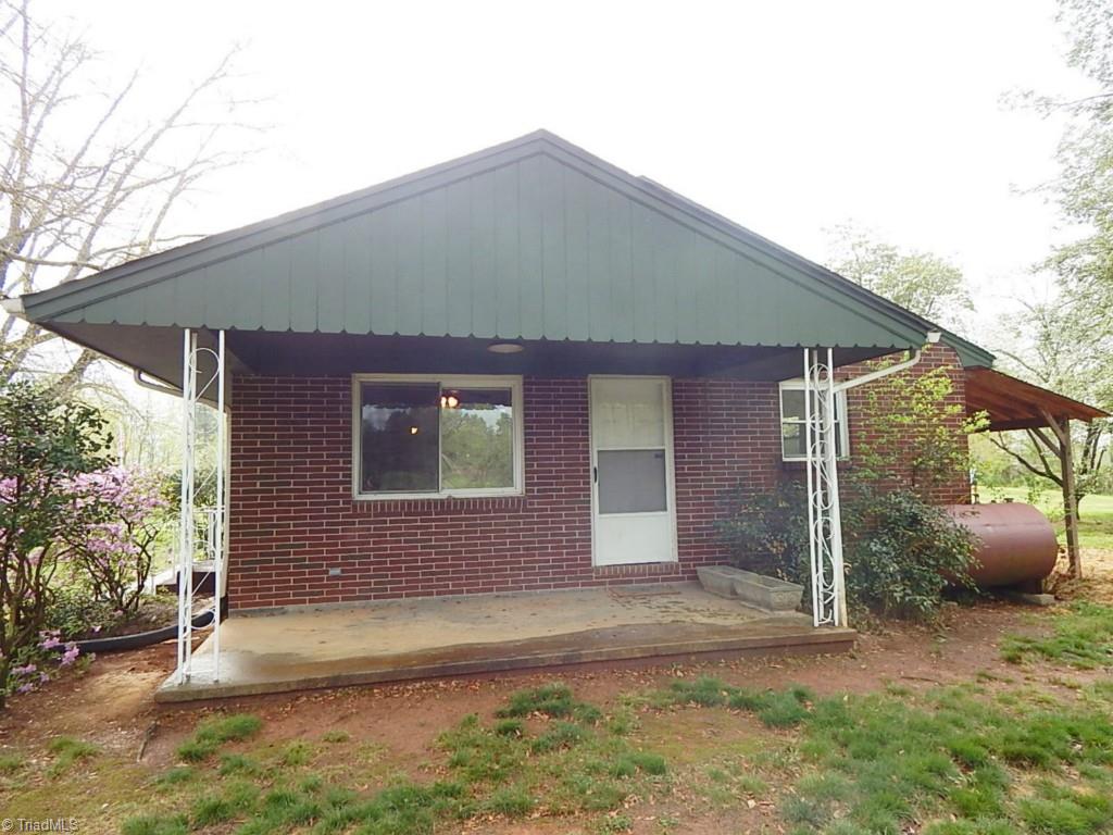 501 Lemons Road Stokesdale, NC 27357 - Photo 24 of 30 Covered side porch