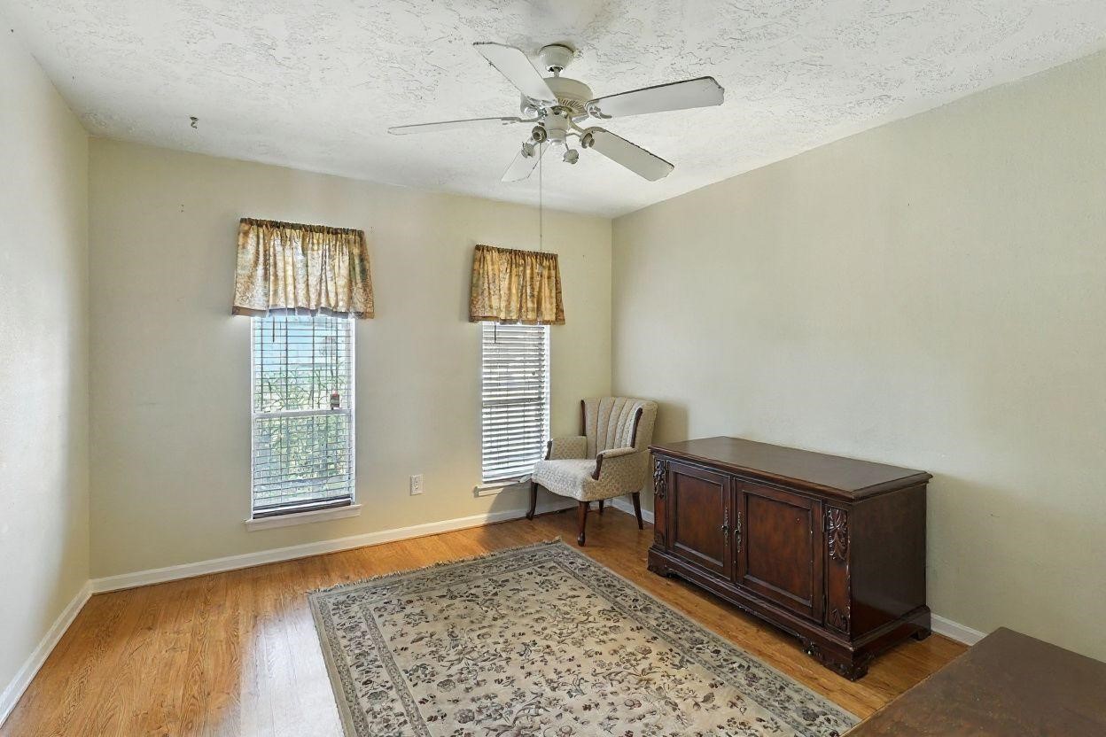6911 Silver Star Drive Houston, TX 77086 - Photo 12 of 15 a living room with furniture and a rug