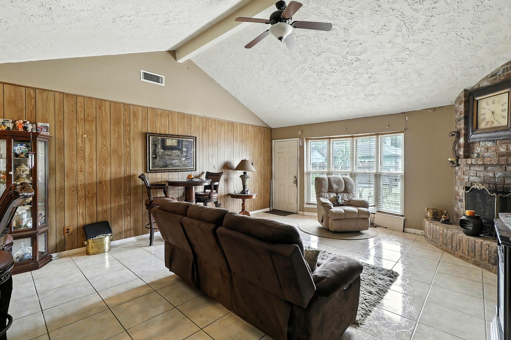 6911 Silver Star Drive Houston, TX 77086 - Photo 4 of 15 a living room with furniture and a large window
