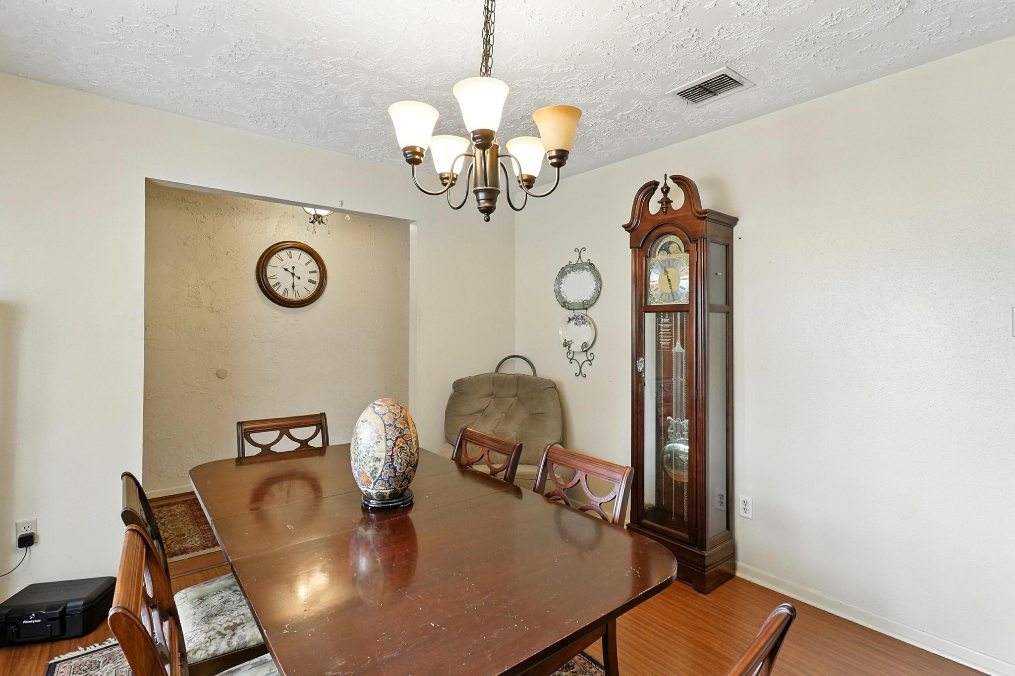 6911 Silver Star Drive Houston, TX 77086 - Photo 8 of 15 a view of a dining room with furniture and a chandelier
