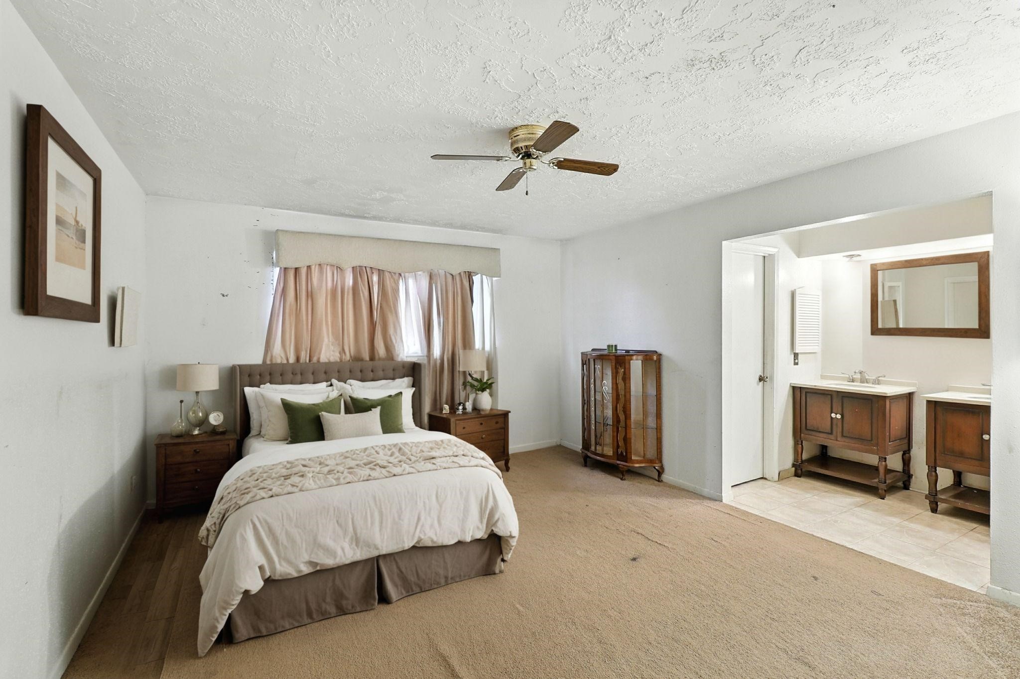 6911 Silver Star Drive Houston, TX 77086 - Photo 10 of 15 a bedroom with double bed and a tv