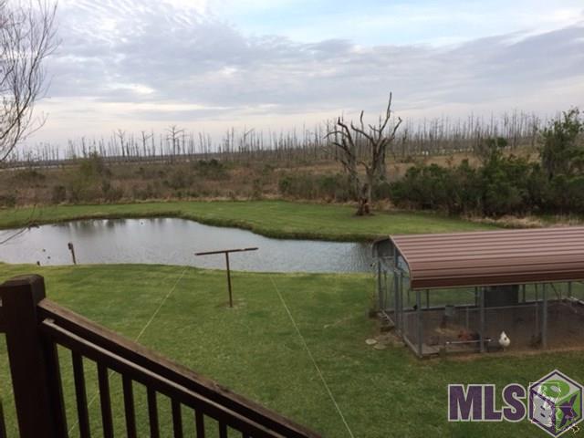1655 Bayou Dularge Road Theriot, LA 70397 - Photo 8 of 43 pond and chicken coop view