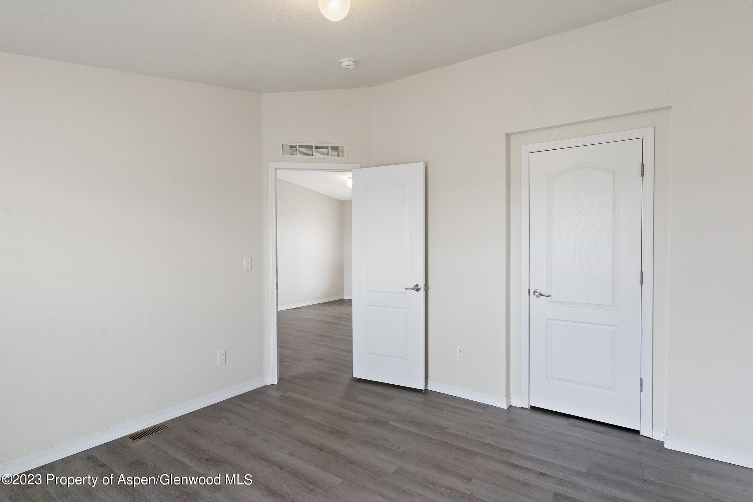 378 Sunset Drive Craig, CO 81625 - Photo 12 of 22 a view of an empty room with wooden floor