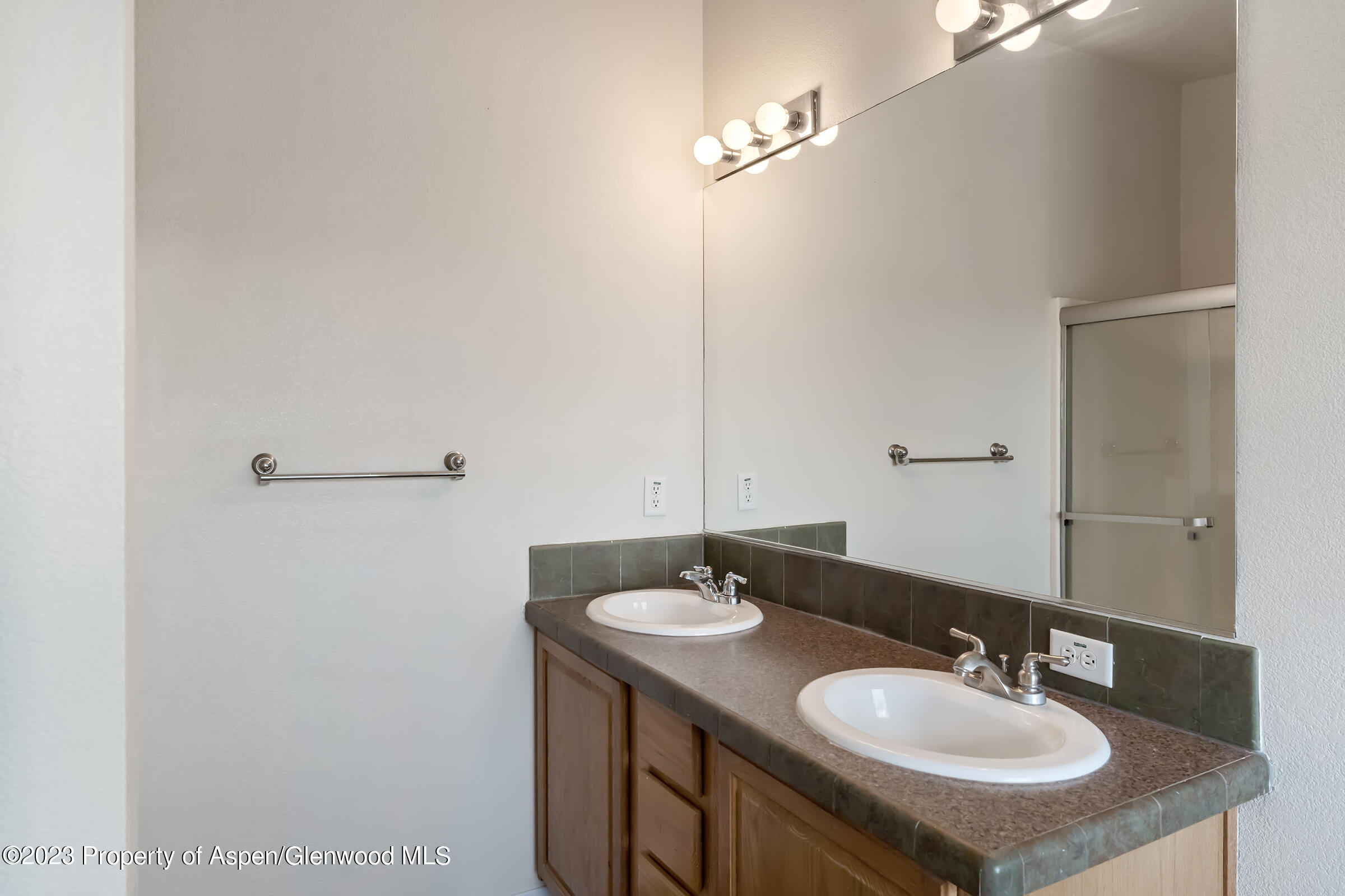 378 Sunset Drive Craig, CO 81625 - Photo 18 of 22 a bathroom with a sink and a mirror