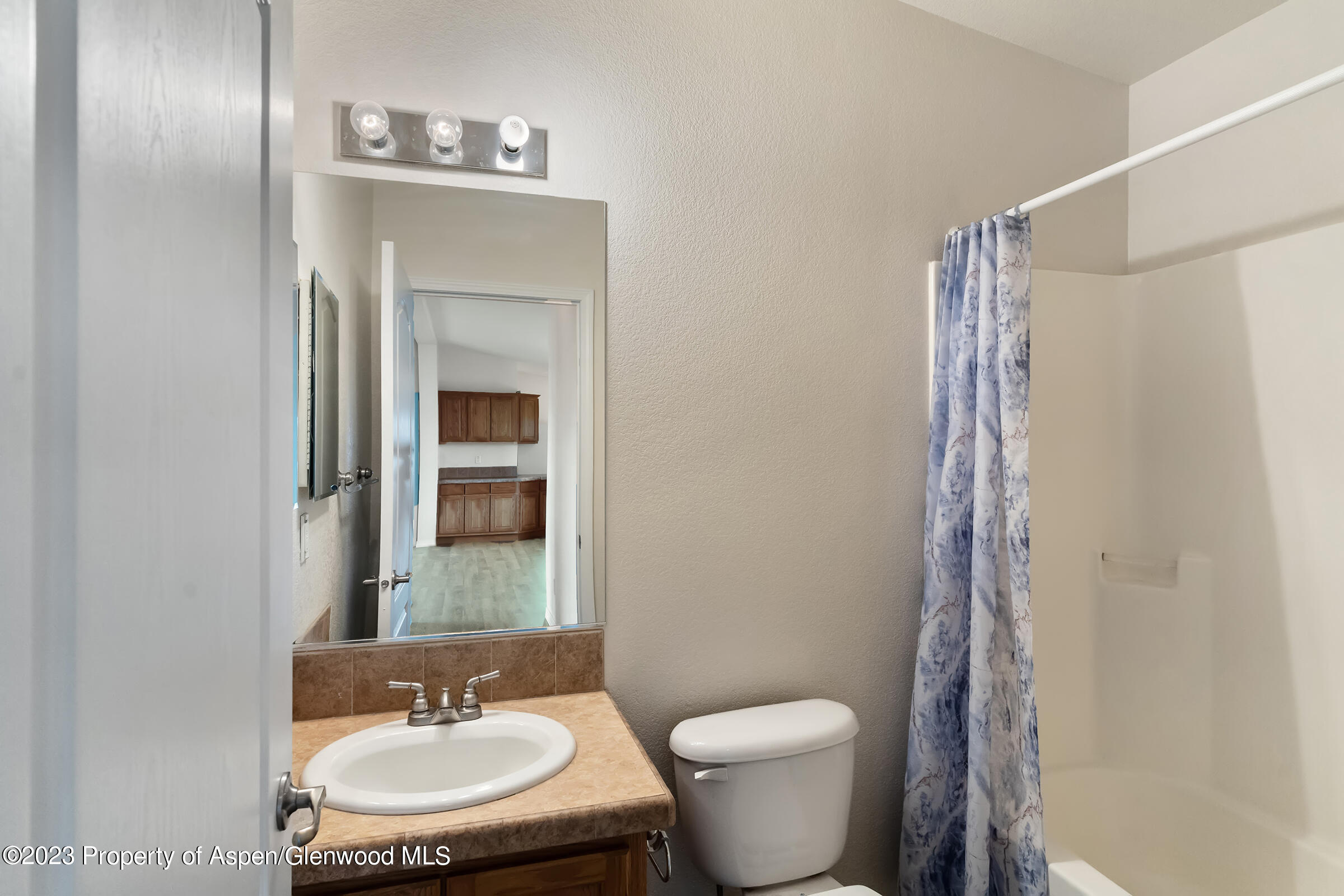 378 Sunset Drive Craig, CO 81625 - Photo 20 of 22 a bathroom with a sink and a mirror