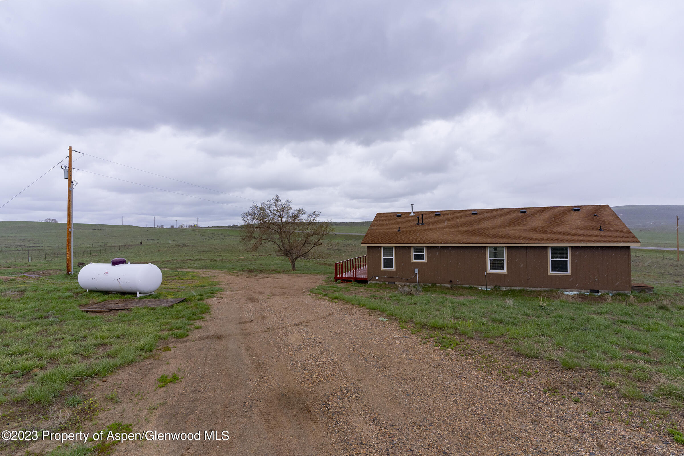 378 Sunset Drive Craig, CO 81625 - Photo 2 of 22 a view of a house with backyard and porch