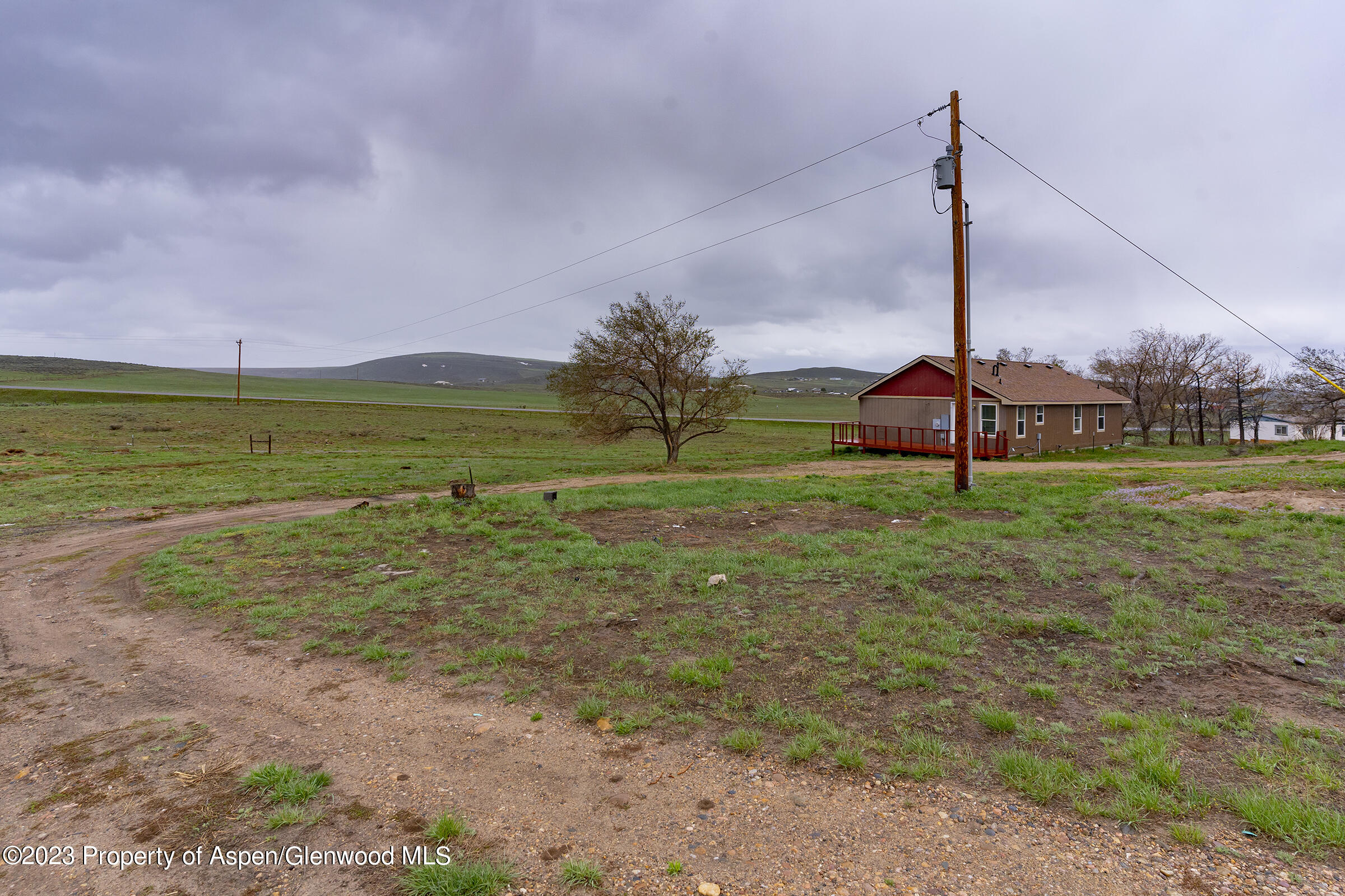 378 Sunset Drive Craig, CO 81625 - Photo 3 of 22 a view of a garden with a tree