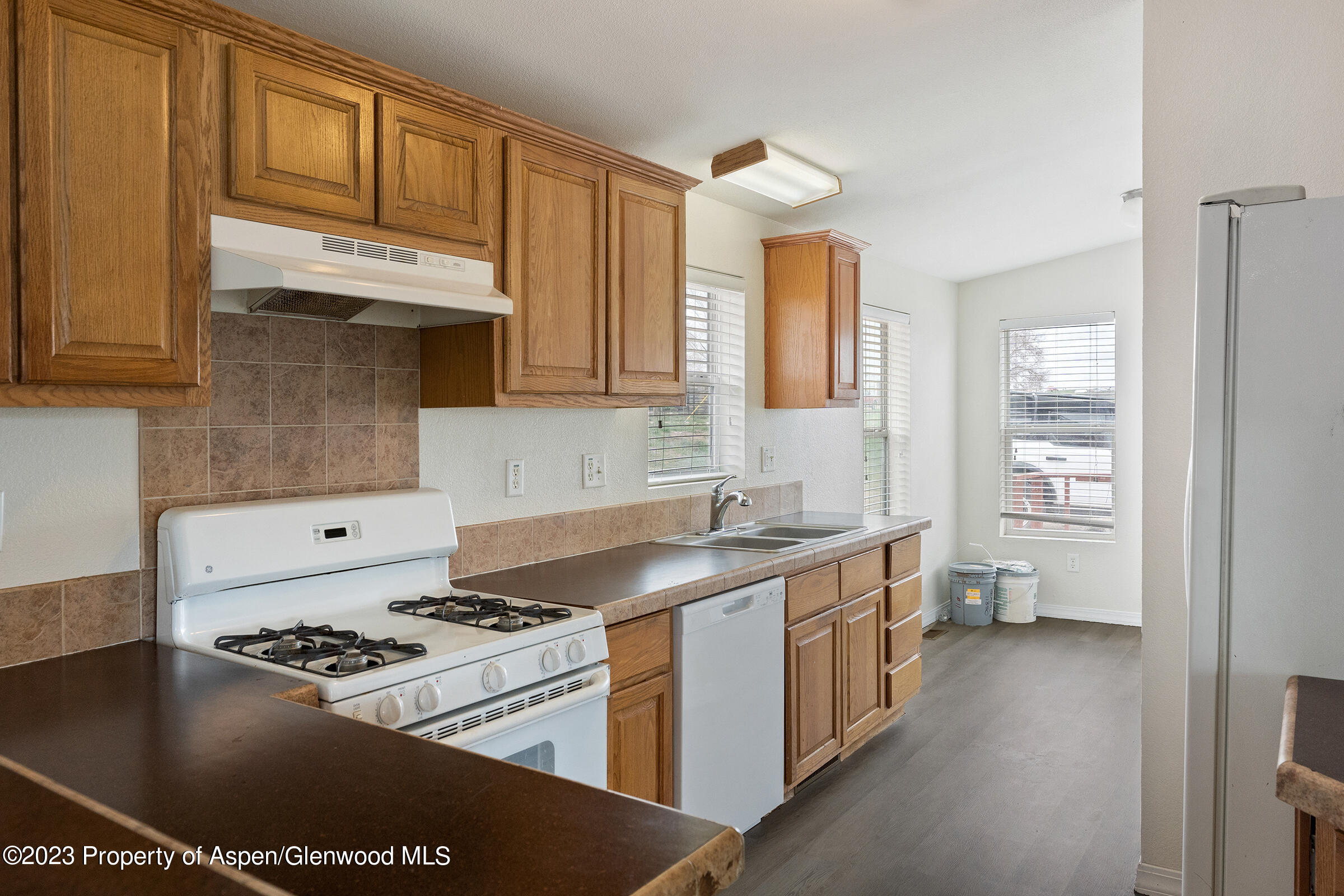 378 Sunset Drive Craig, CO 81625 - Photo 6 of 22 a kitchen with a stove a sink and cabinets