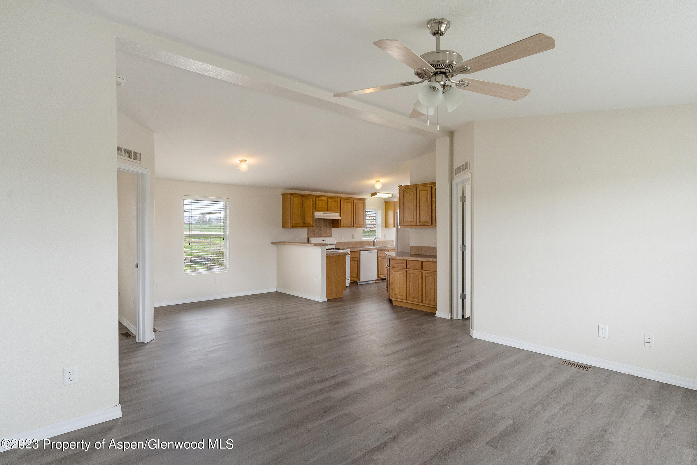 378 Sunset Drive Craig, CO 81625 - Photo 8 of 22 a view of a kitchen with a sink a stove top oven and cabinets
