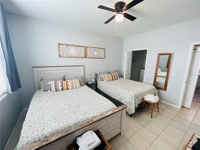 a bathroom with a double vanity sink toilet and shower