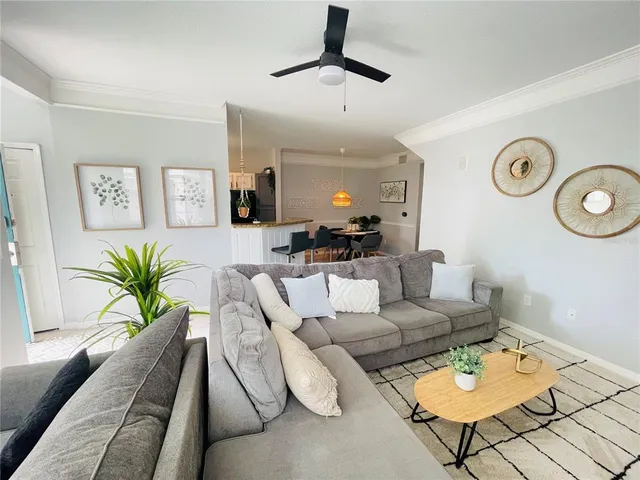 a living room with furniture and a rug
