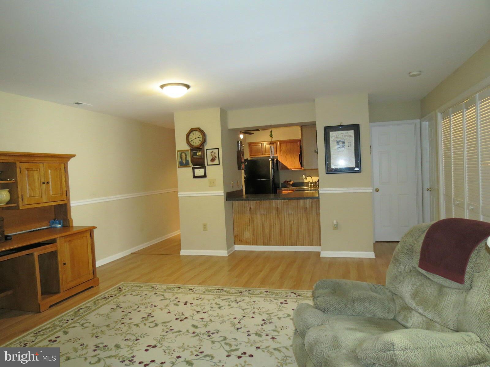 11920 Liberty Road, Unit 206B Frederick, MD 21701 - Photo 5 of 12 Living Room into Kitchen view