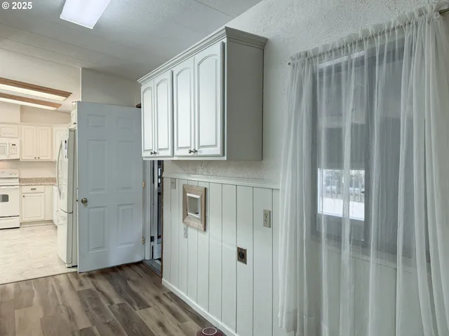 a view of bedroom with wooden floor