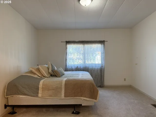 a bathroom with a sink vanity granite shower and a mirror