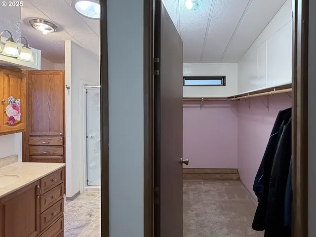 a bathroom with a glass shower door