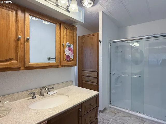 a bedroom with a bed and a mirror