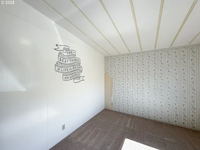 a bathroom with a granite countertop sink vanity mirror and toilet