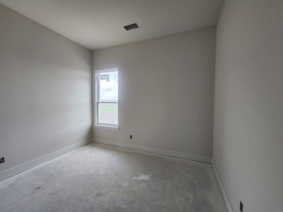2320 Quartz Street Krum, TX 76249 - Photo 11 of 17 an empty room with a window