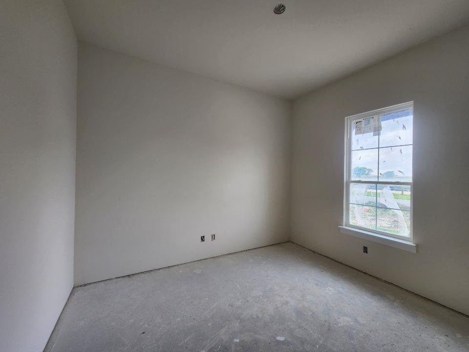 2320 Quartz Street Krum, TX 76249 - Photo 3 of 17 an empty room with a window