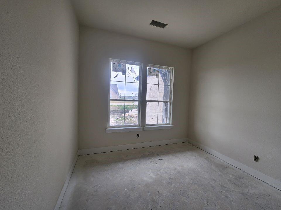 2320 Quartz Street Krum, TX 76249 - Photo 7 of 17 an empty room with a window