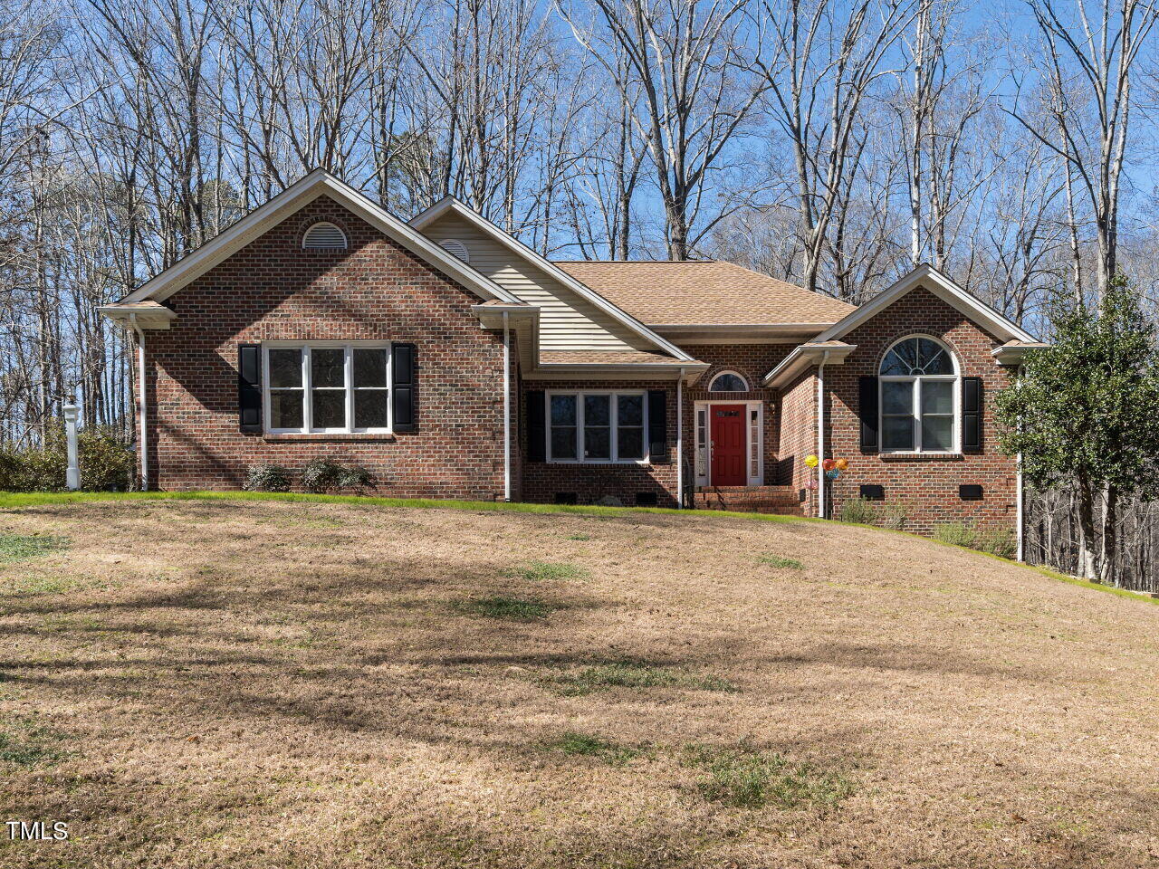 1048 Shadywood Lane Raleigh, NC 27603 - Photo 1 of 35 a front view of a house with a garden