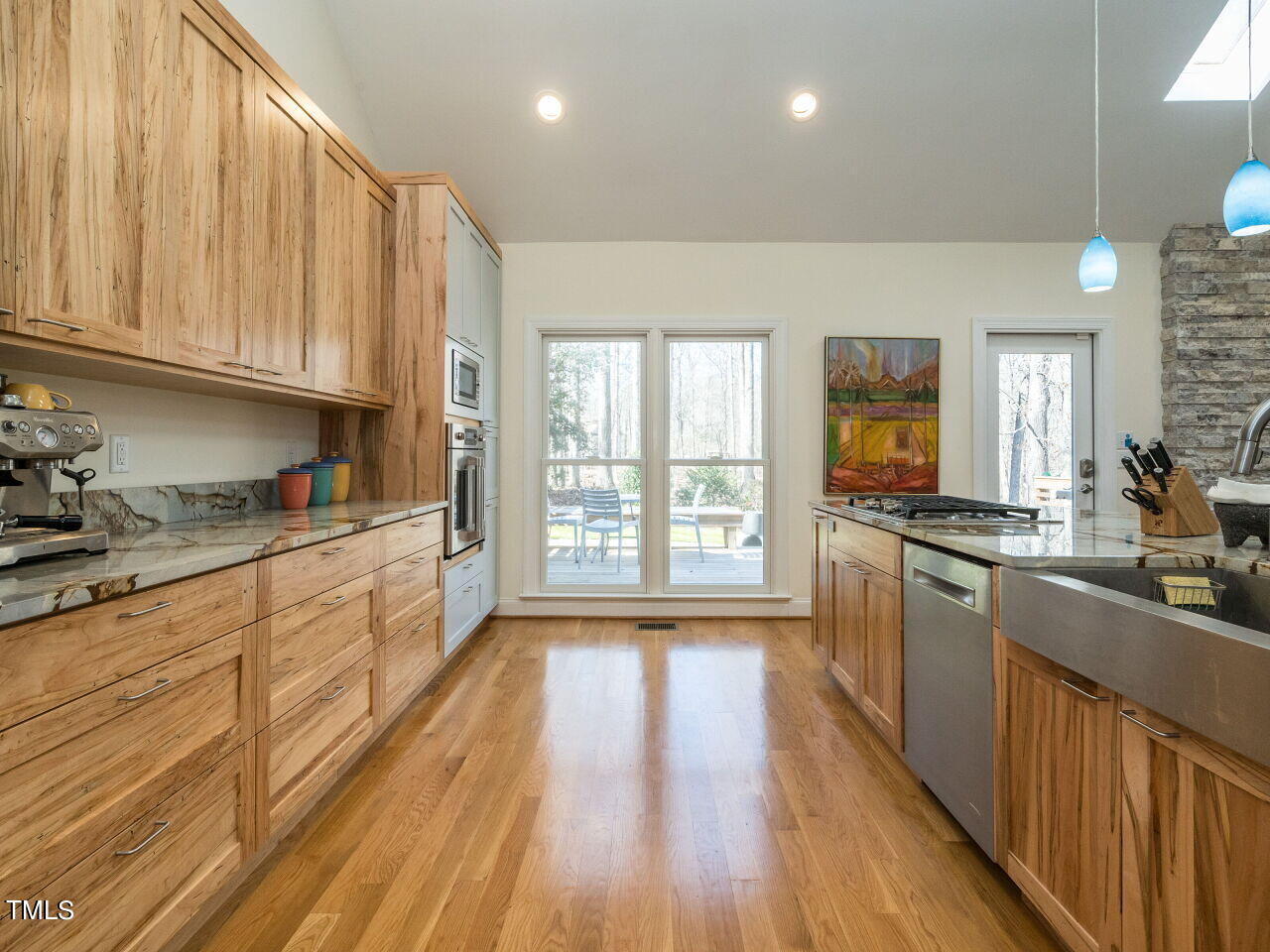 1048 Shadywood Lane Raleigh, NC 27603 - Photo 14 of 35 a kitchen with stainless steel appliances granite countertop a stove a sink dishwasher and a refrigerator with wooden floor