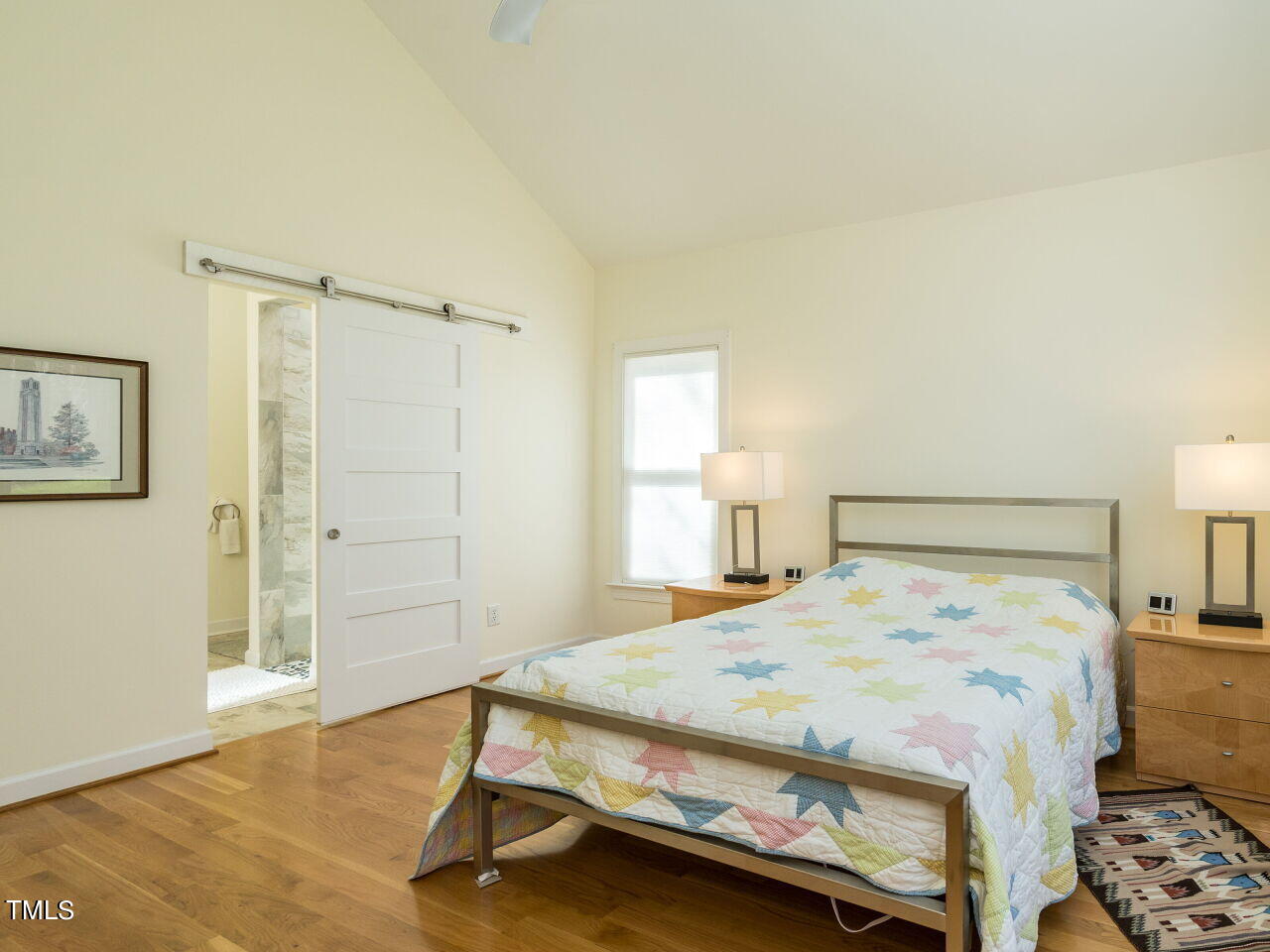 1048 Shadywood Lane Raleigh, NC 27603 - Photo 17 of 35 a bedroom with a bed and a table in it