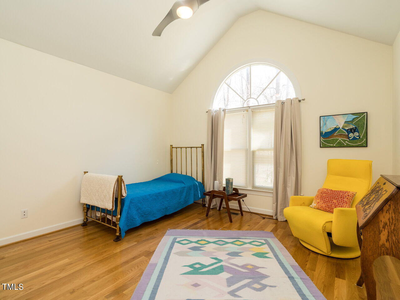 1048 Shadywood Lane Raleigh, NC 27603 - Photo 20 of 35 a bedroom with a bed and wooden floor