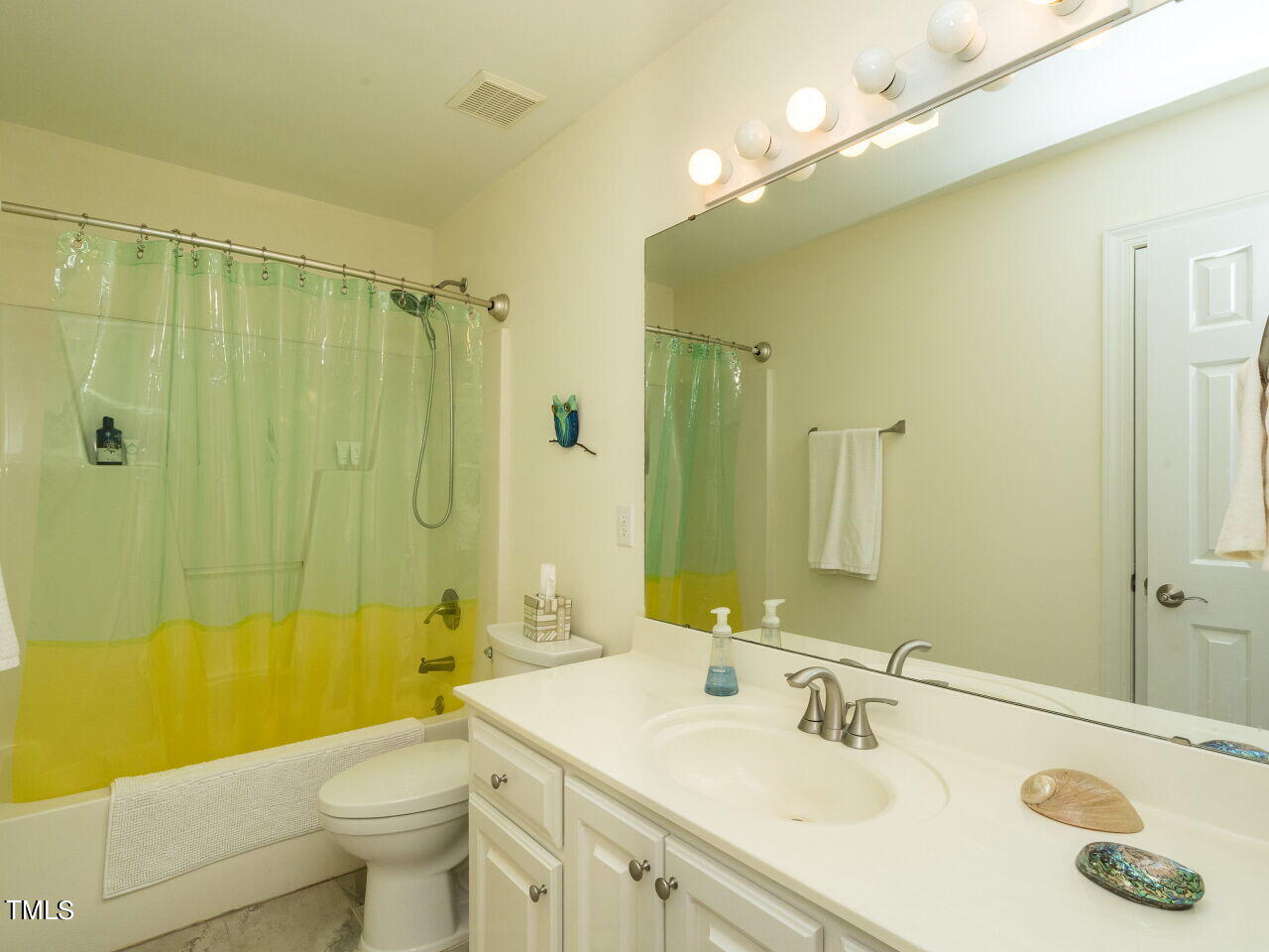 1048 Shadywood Lane Raleigh, NC 27603 - Photo 21 of 35 a bathroom with a sink a toilet and shower