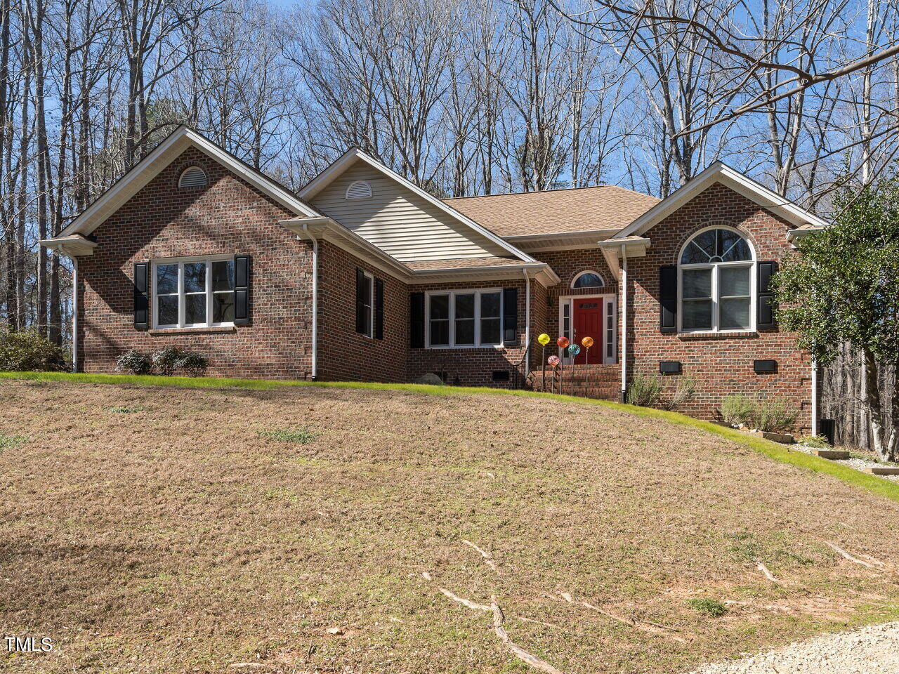 1048 Shadywood Lane Raleigh, NC 27603 - Photo 32 of 35 a front view of a house with a yard and garage