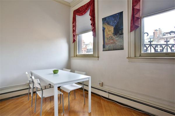 165 Beacon Street, Unit 8 Boston, MA 02116 - Photo 5 of 8 a view of a room that has a window and wooden floor