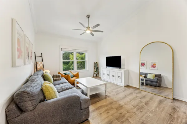 a living room with furniture and a flat screen tv