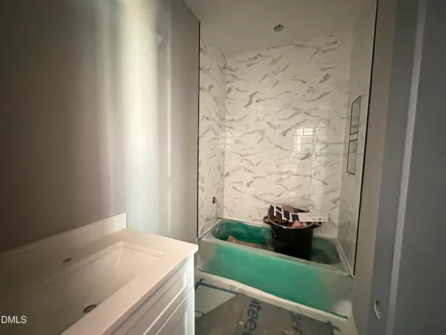 a bathroom with a sink and a shower