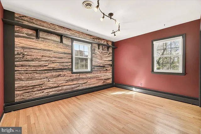a kitchen with a stove a sink and a refrigerator
