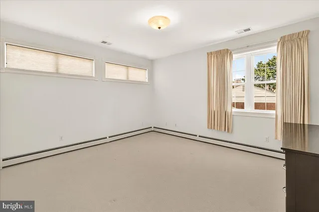 a view of a living room and dining room