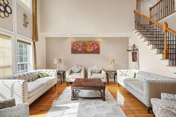 a living room with furniture and a rug