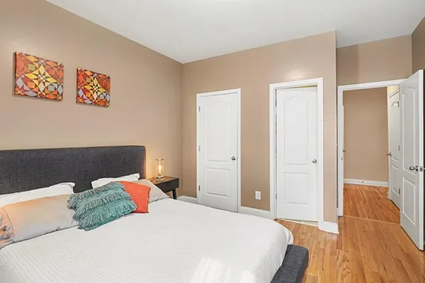 a bedroom with a bed and a cabinets