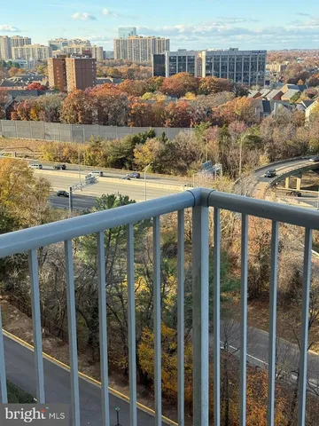 a view of a balcony with city