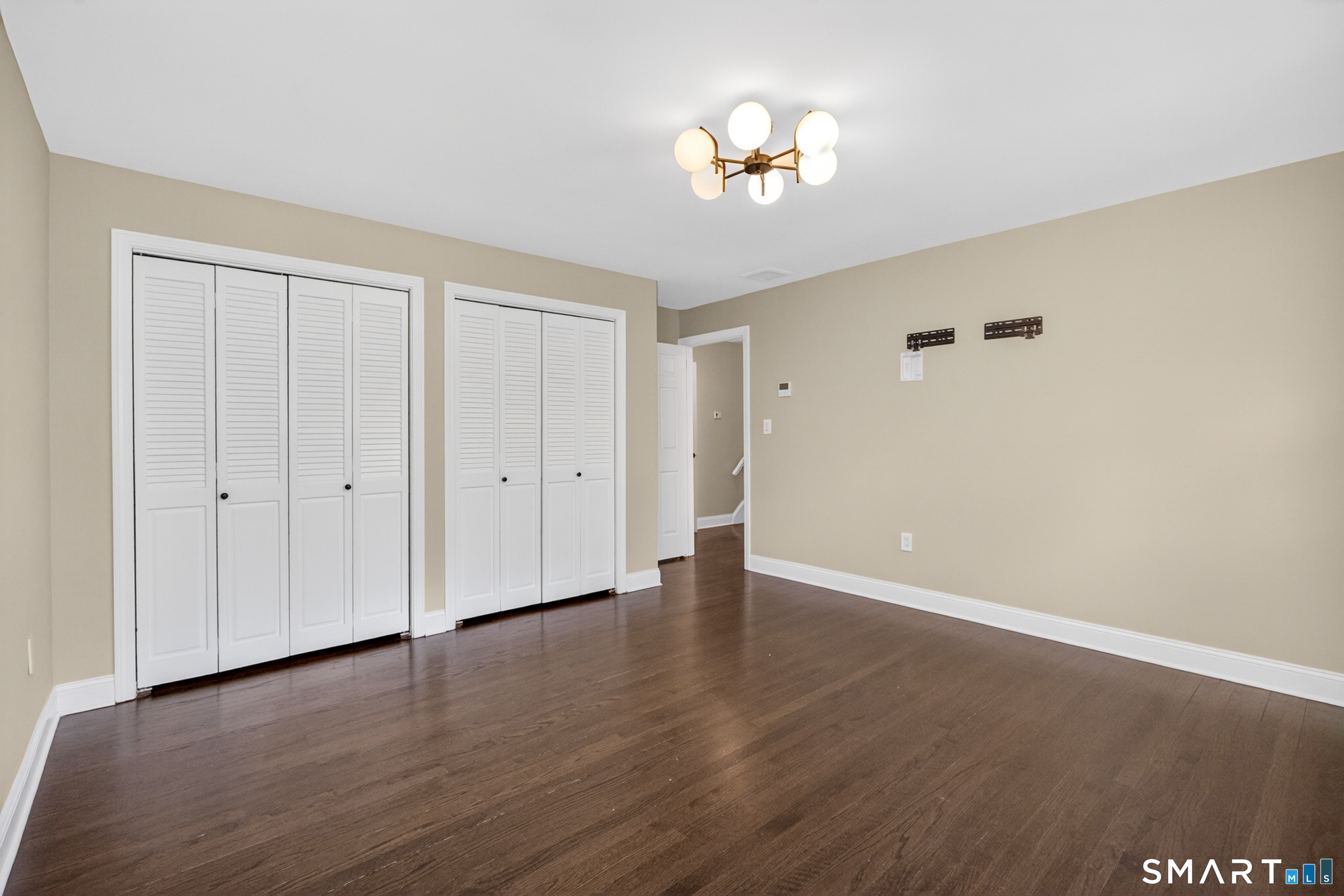 568 Wiese Road Cheshire, CT 06410 - Photo 20 of 40 a view of an empty room with wooden floor