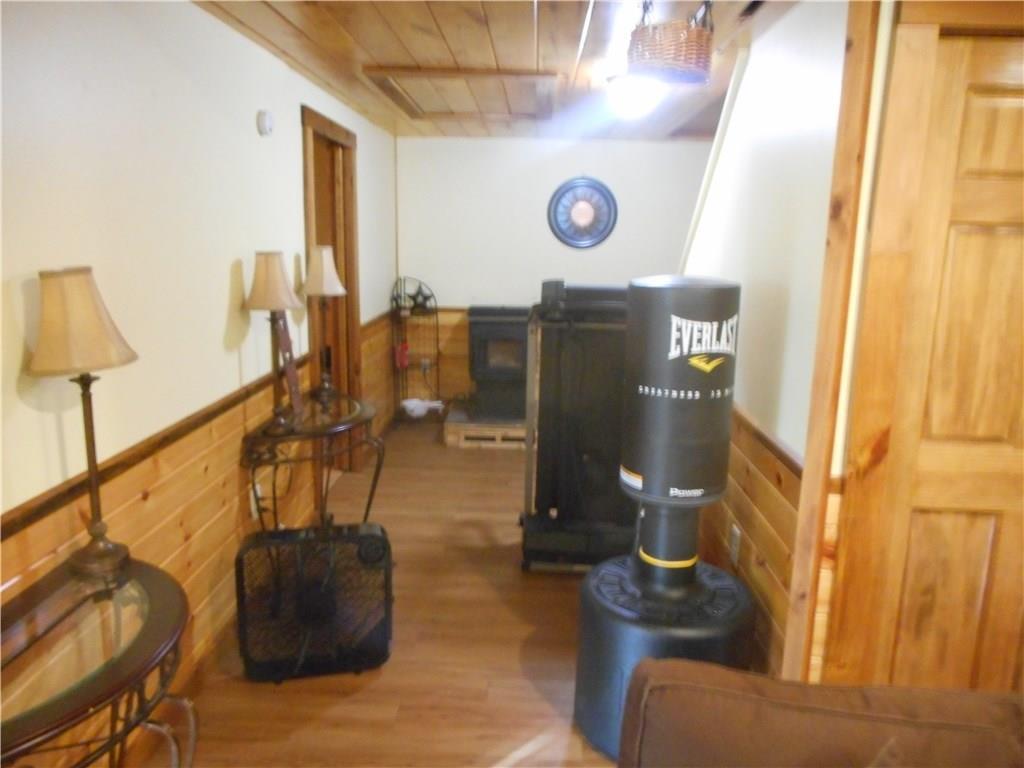 67 Maple Grove South China, ME 04358 - Photo 26 of 33 First floor hallway with pellet stove.