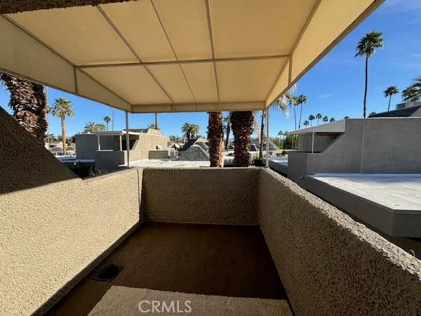 a view of a porch with furniture