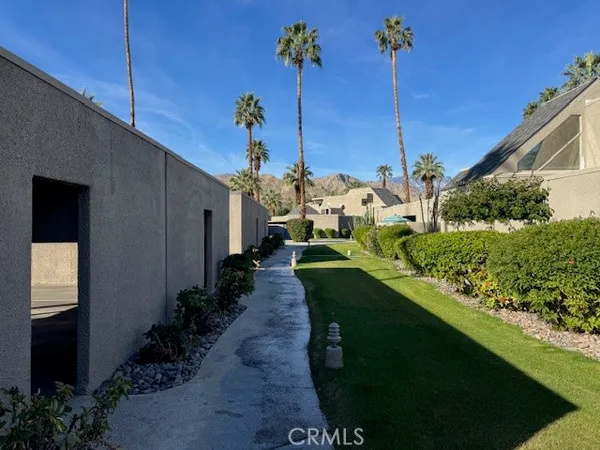 a view of a house with a backyard and garden