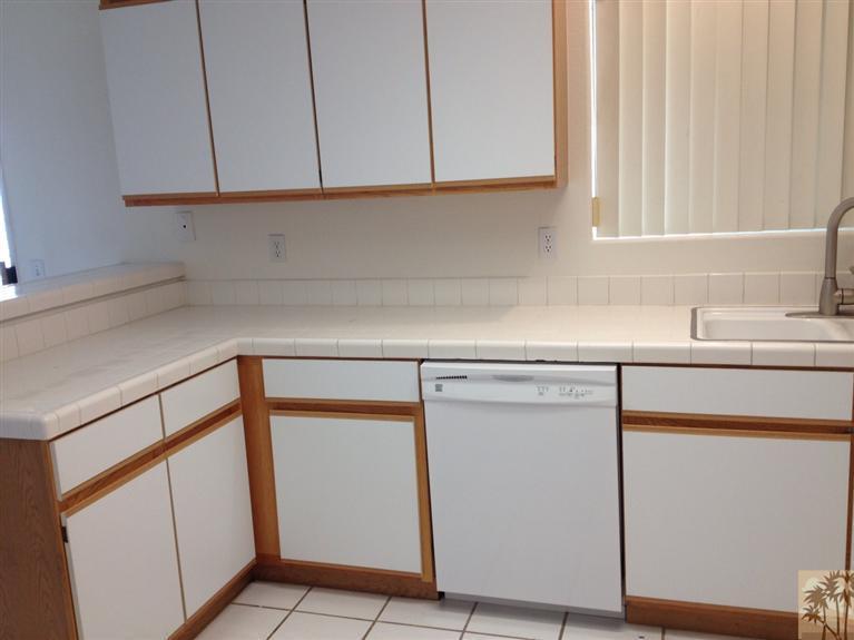68260 Risueno Road Cathedral City, CA 92234 - Photo 14 of 25 a kitchen with a sink and a cabinets