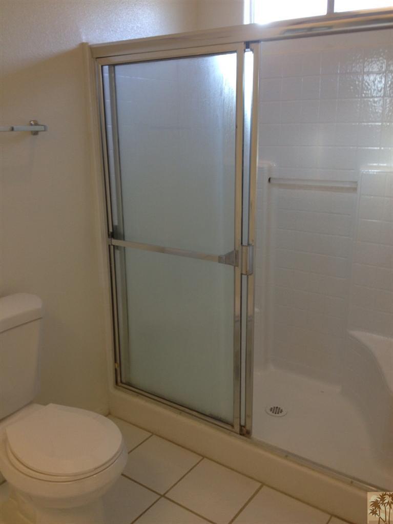 68260 Risueno Road Cathedral City, CA 92234 - Photo 19 of 25 a bathroom with a toilet and a shower